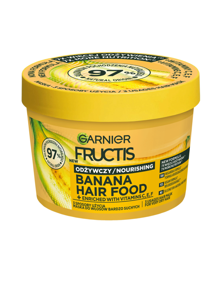 Żółta tuba Garnier Fructis Banana Hair Food, stoi na białym tle, etykieta informuje o odżywieniu.